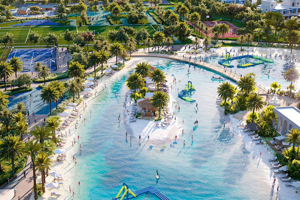 A lagoon with a beach, a park, and home lounges